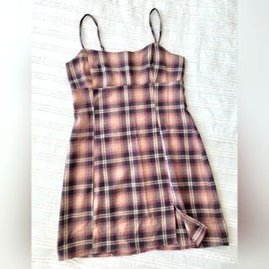 Cute plaid mini dress with adjustable spaghetti straps.